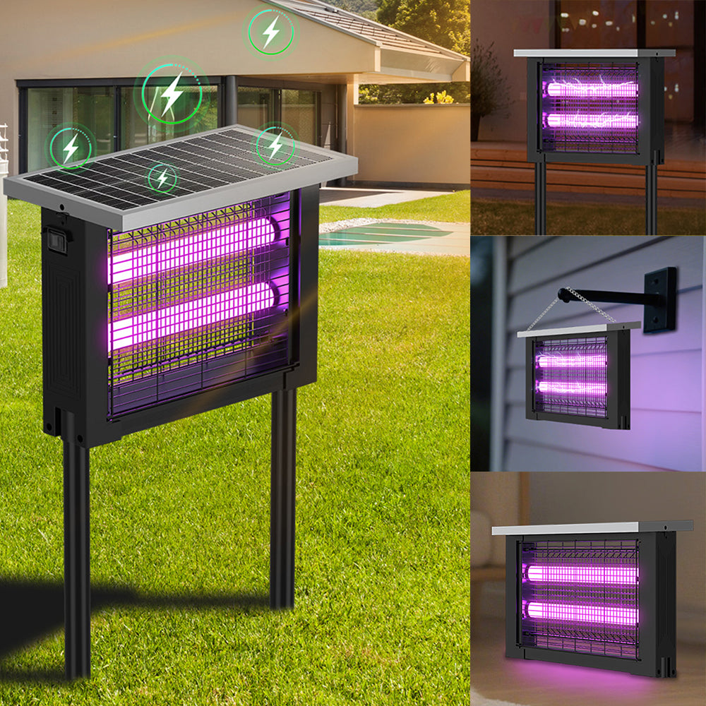Insect zapper with solar panel on grass, close-up of purple lights, and outdoor setting.