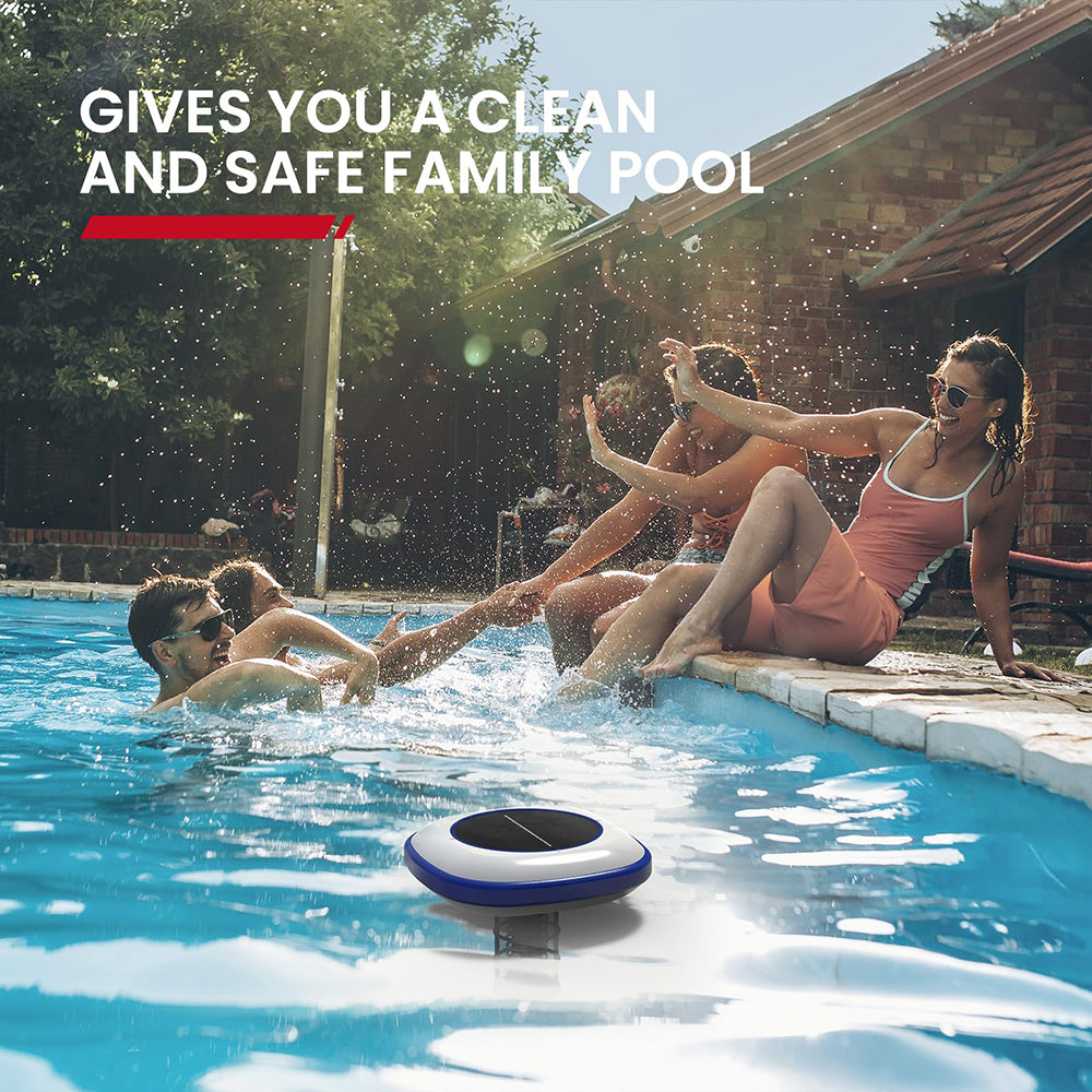 People enjoying a pool with a solar pool cleaner in the foreground, set against a scenic backyard.