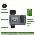 AxiaTool LED display timer automatic watering sprinkler in a garden setting, showing dials and hose connections.