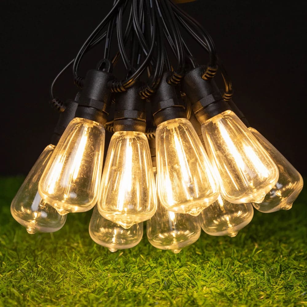 AxiaTool solar outdoor string lights illuminating a garden, featuring warm glow and decorative design for festive ambiance.