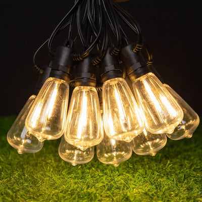 AxiaTool solar outdoor string lights illuminating a garden, featuring warm glow and decorative design for festive ambiance.