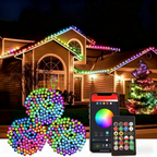 500 LED smart color changing Halloween lights by AxiaTool illuminating a spooky outdoor setting at night.