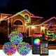 500 LED smart color changing Halloween lights by AxiaTool illuminating a spooky outdoor setting at night.