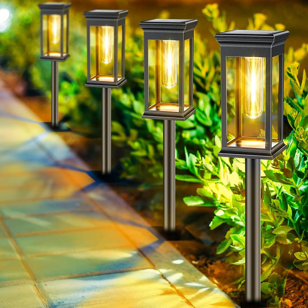 AxiaTool solar pathway lights illuminating a garden pathway with warm, glowing LED lights at dusk.