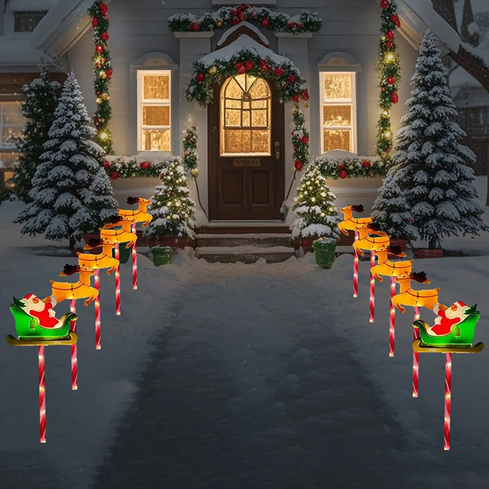 Solar powered outdoor Christmas decorative lights by AxiaTool illuminating a festive winter landscape at night.