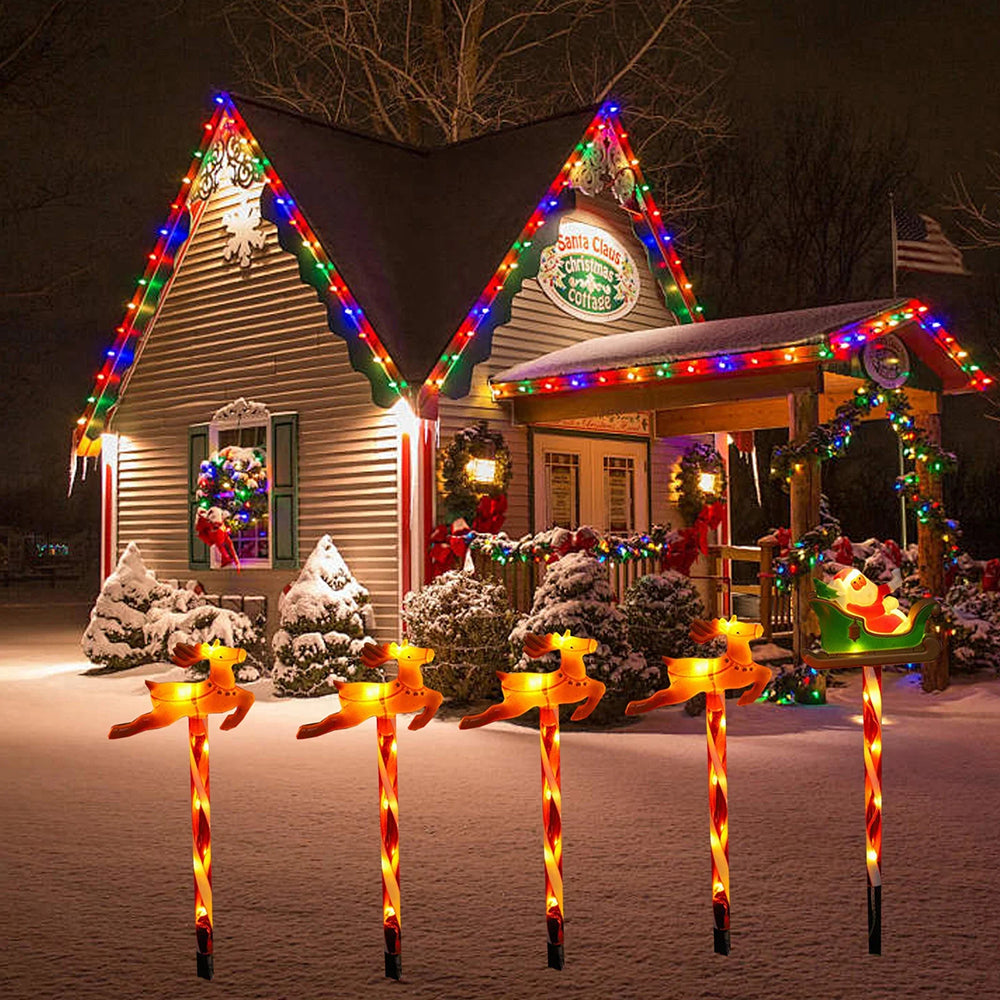 Solar powered outdoor Christmas decorative lights by AxiaTool glowing warmly in a festive outdoor setting.