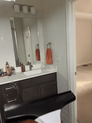 AxiaTool electric cordless window vacuum cleaner with sleek design and ergonomic handle for easy window cleaning.