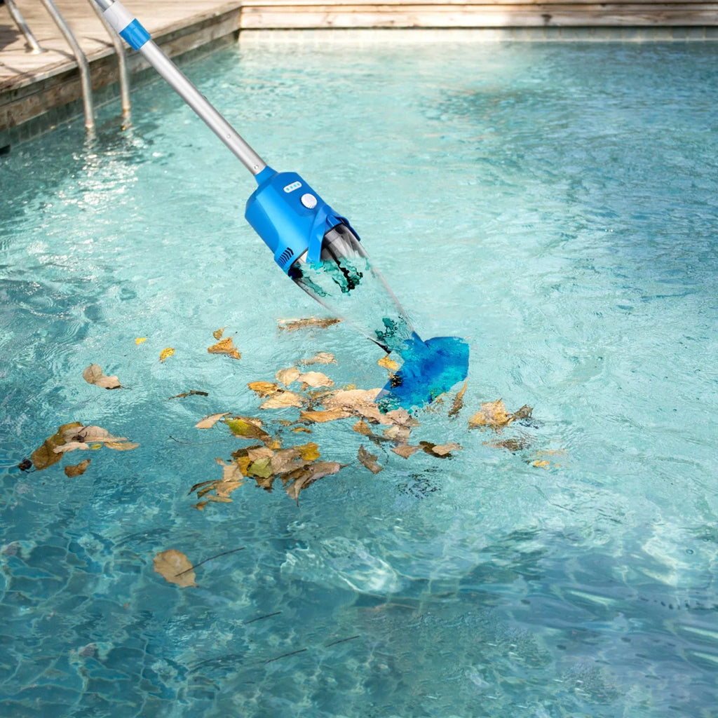 Blue pool cleaning tool removing leaves from a swimming pool