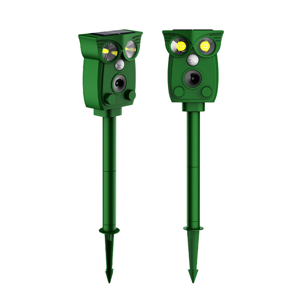 Two green owl-shaped solar-powered pest controllers on a white background