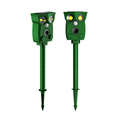 Two green owl-shaped solar-powered pest controllers on a white background